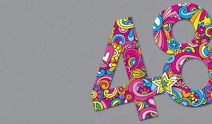 Number 48 colored with pink swirls, stars and blue flowers on a gray backdrop