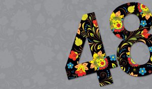 Black number 48 colored with yellow, red and blue flowers on a gray backdrop