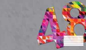 Black number 48 colored with purple red and yellow squares on a gray backdrop