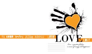 Orange heart in the palm of a black ink print hand on a white backdrop