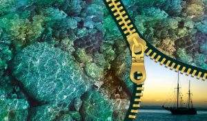 Underwater teal pebbles rocks with a sailing ship