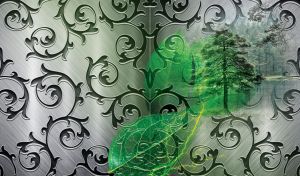 Decorative iron grill with green leaves and tree on a steel background