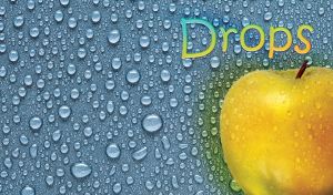 Water drops from a delicious yellow apple fruit