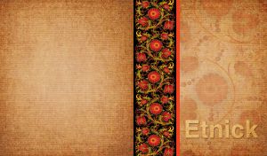 Golden and red ethnic floral design on a black panel on an ocher fabric texture