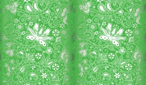 Silver floral batik ornament on a light green backdrop