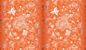 Silver floral batik ornament on a dark orange backdrop