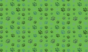 Abstract seamless pattern with paw prints against a green backdrop