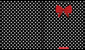 Red bow on a black and white polka dot background