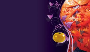 Shiny red tomato slices close up, purple grapes and a yellow tomato on dark purple