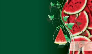 Shiny red watermelon slices with seeds and green grapes on green