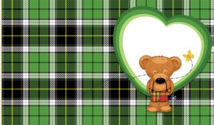 Teddy bear with a flower against a big heart on blue and black plaid backdrop