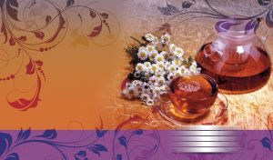 Glass teapot and a cup of tea on a wooden table near white daisies