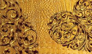 Golden swirl heart stencil on yellow leather texture