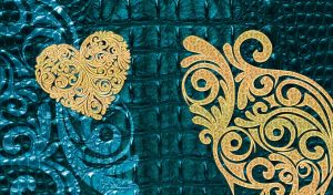 Golden swirl ornament stencil on dark teal leather texture
