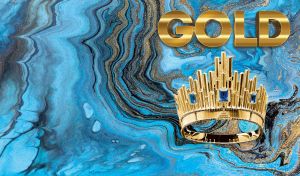 Gold crown with blue sapphires on gold and blue marble background