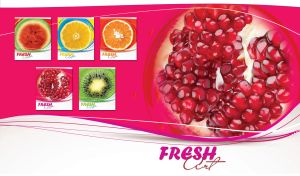 Fresh pomegranate cut in a half on fuchsia pink and white abstract background
