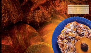 French cinnamon roll with icing and half an apricot on a brown background