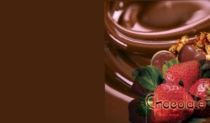 Strawberries and chocolate candies on melted caramel chocolate