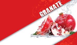 Pomegranate cut into pieces next a red pomegranate in the water splash