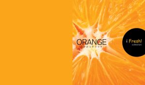 A close-up image of a ripe juicy orange in a cut against an orange background