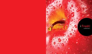 Close-up image of a juicy red apple in dew on a bright red background