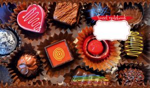 Close-up of colorful chocolate candies in brown foil candy cups