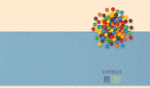 Colorful dragee on beige and textured light blue dual backdrop