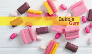 Assorted pink bubble gum pieces scattered on a white backdrop