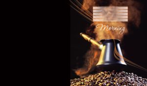 Black coffee pot with steam stands on a pile of coffee beans on black