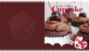 Chocolate cupcakes with mocha cream and cherries on top on dark brown background
