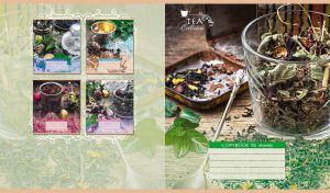 Herbal tea blend in a glass and a tea spoon on a wooden table