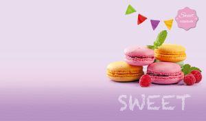 Colorful macaroons and raspberries on a purple gradient backdrop