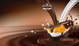 Juicy orange slice in splashes of milk and chocolate on a brown backdrop