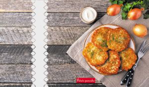 Delicious homemade potato pancakes on a wooden-textured backdrop
