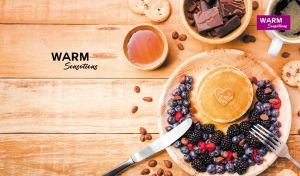 Overhead shot of a breakfast arrangement on a wood-textured backdrop