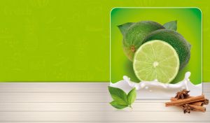 Limes with mint and cinnamon sticks isolated against a lime green wallpaper