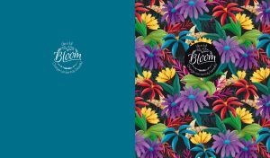 Vibrant tropical floral patterns cover half the space of a teal backdrop