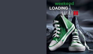 Green high-top sneakers close-up against a black rock landscape