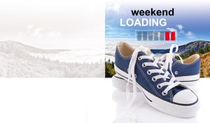 Blue classic skate shoes close-up against a hazy mountain landscape