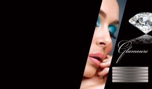 Piece portrait of a woman bright blue eye makeup next to a diamond on black surface