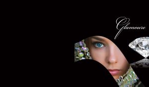 Piece portrait of a woman with blue eyes and nickles next to a diamond on black surface