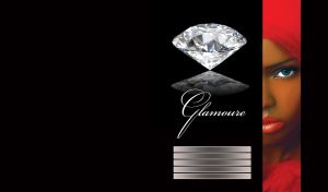 Piece portrait of a woman with blue eyes and red veil next to a diamond on black surface