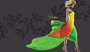 Short hair blonde model in a three color dress posing against a black background