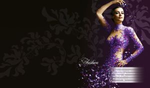 Brunette female model in a confetti dress posing against purple-black background