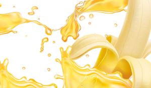 Yellow juicy splashes and a banana on a white background