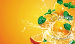 Slices of fresh oranges in water splashes on yellow-orange