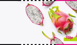 Whole and half pitaya fruits on white backdrop