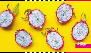 Fuchsia pink dragon fruit halves on a yellow backdrop