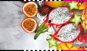 Composition of pitaya and exotic fruit mix on a grey textured background