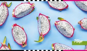 Composition of slices of dragon fruit in a seamless pattern on pastel blue